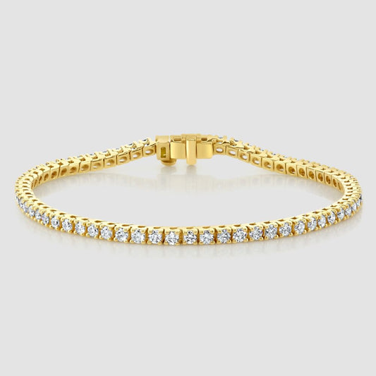 Laboratory diamond claw set line bracelet in yellow gold – small