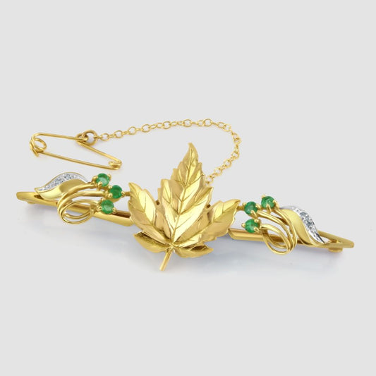 Maple leaf bar brooch with emeralds and diamonds