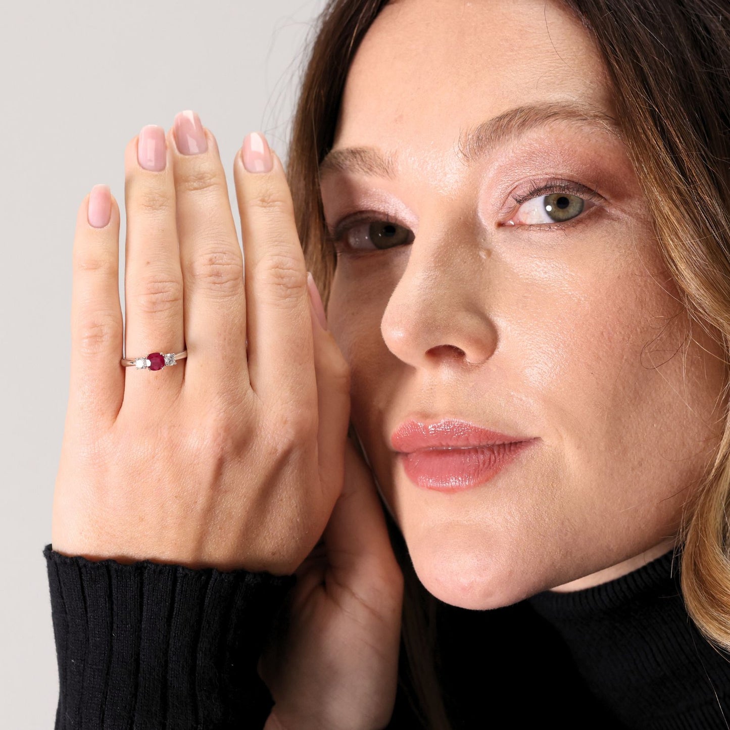 Ruby and diamond claw set three stone ring