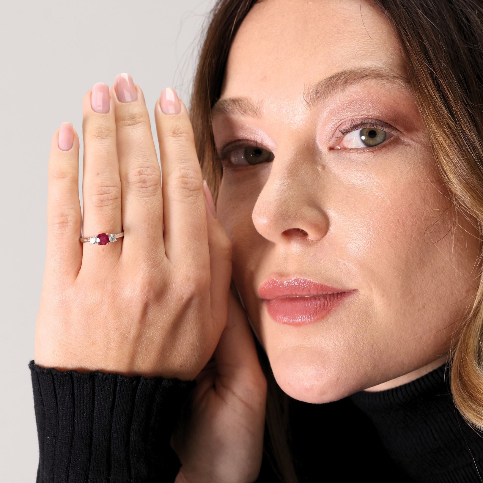 Ruby and diamond claw set three stone ring