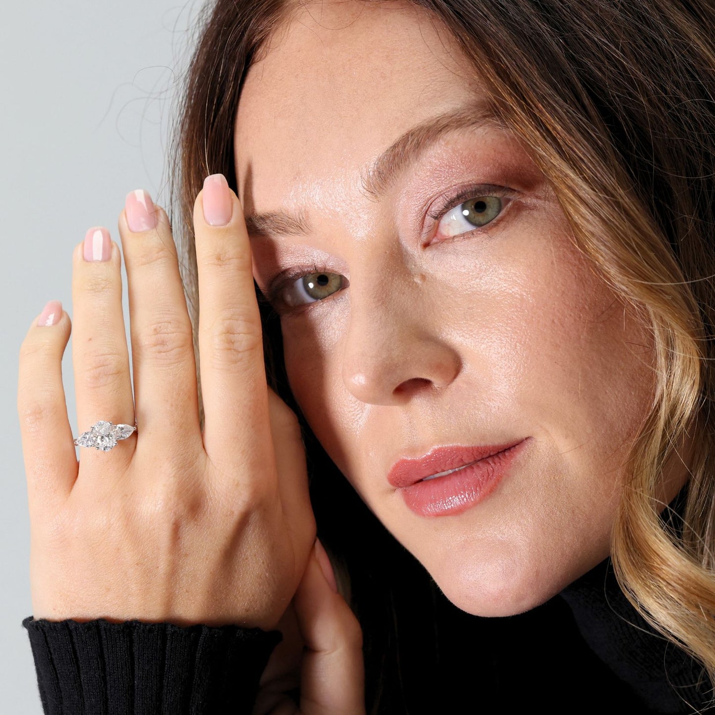 Laboratory diamond three stone oval and pear shape ring