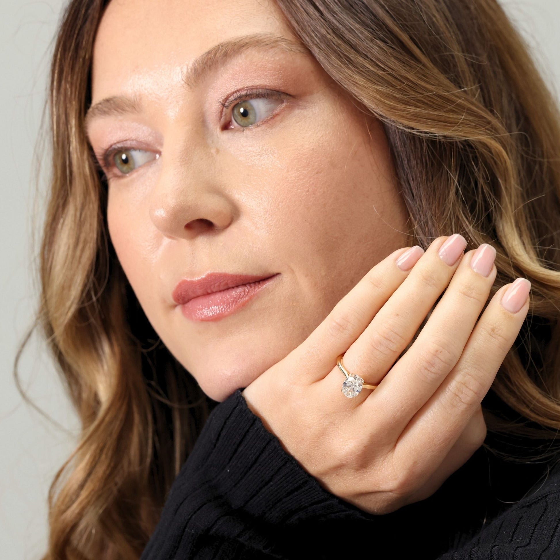 Oval cut laboratory diamond solitaire ring with ‘Bloom’ setting