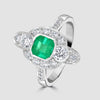 Platinum Art Deco style emerald and diamond cluster ring