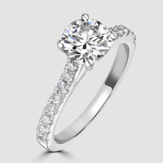 Platinum diamond solitaire with diamond set shoulders