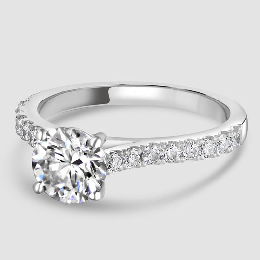 Platinum diamond solitaire with diamond set shoulders