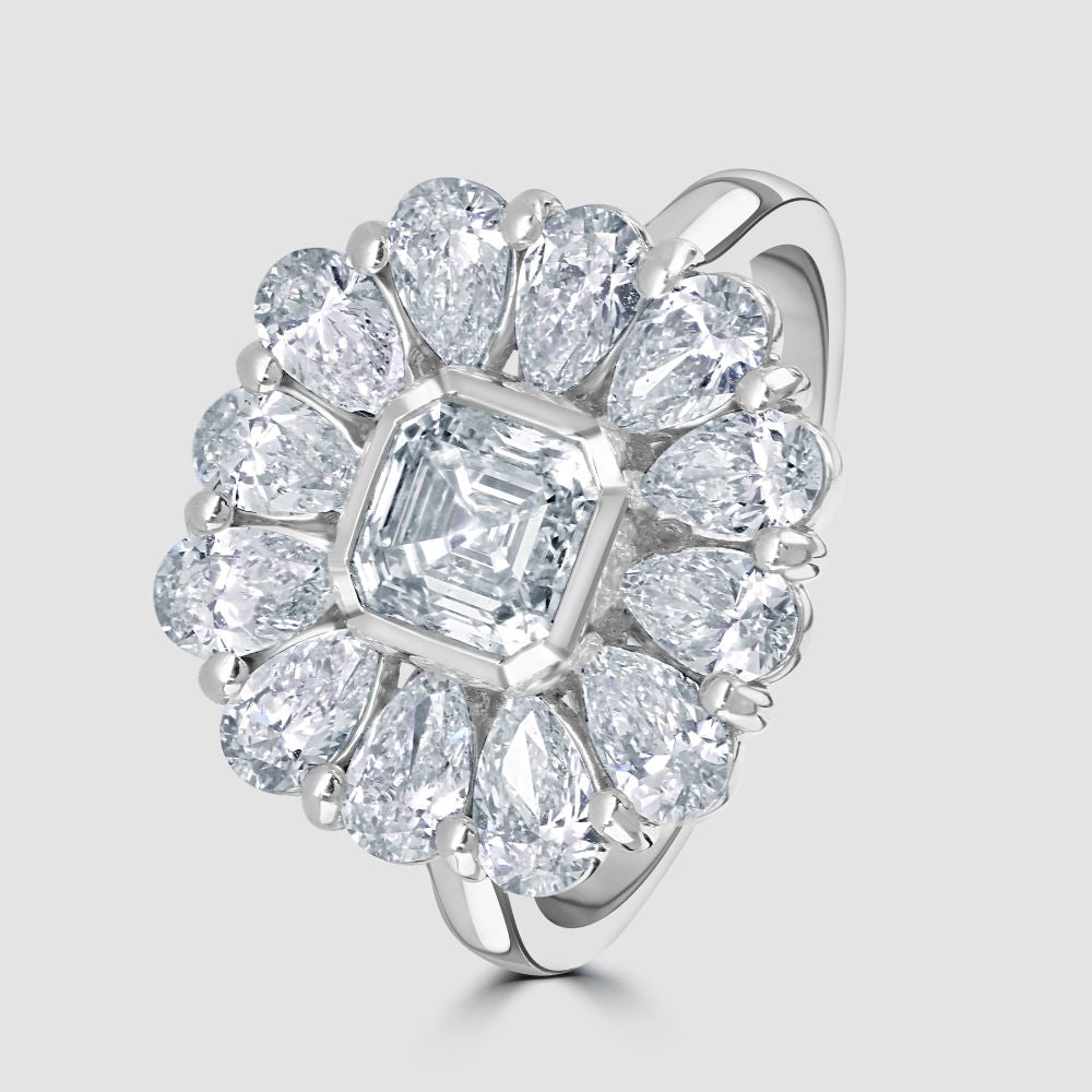 Platinum pear shape and Asscher cut diamond cluster ring