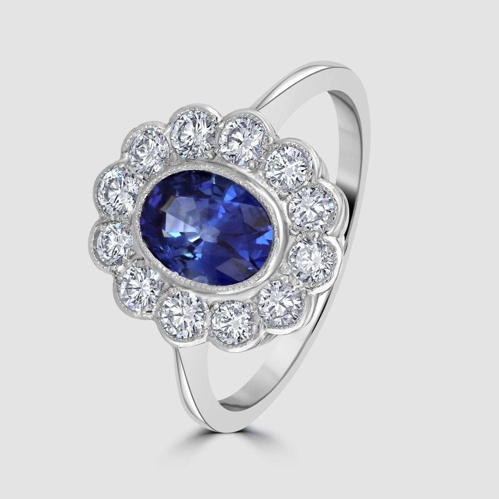 Sapphire and diamond scalloped edge cluster ring