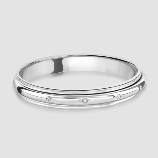 18 carat white gold bangle with diamond set rotating centre-