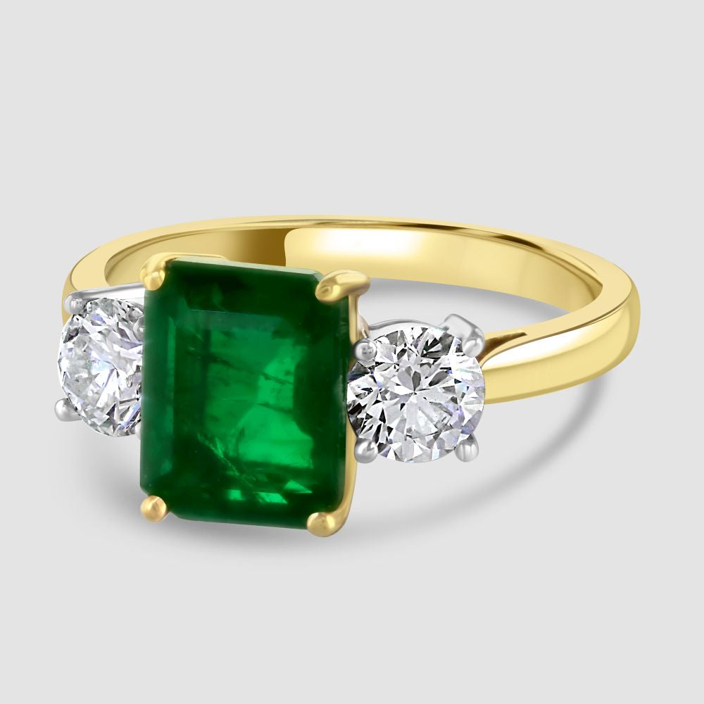 Stunning emerald and diamond three stone ring