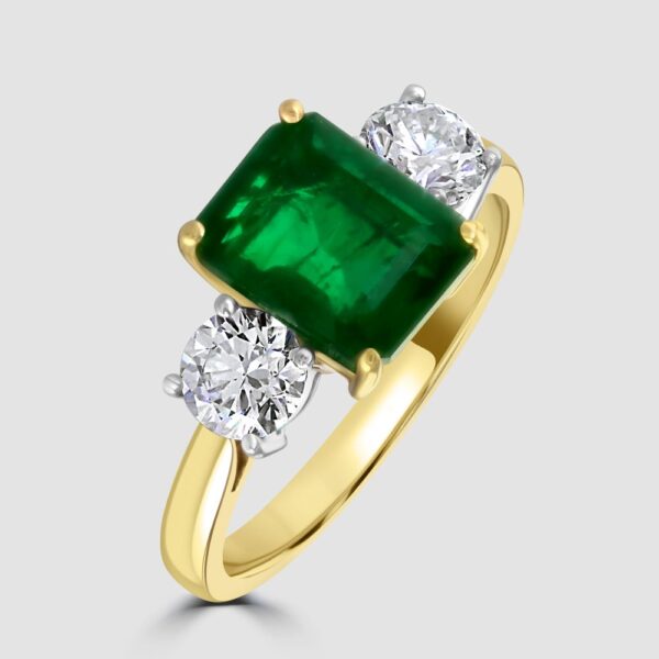 Stunning emerald and diamond three stone ring