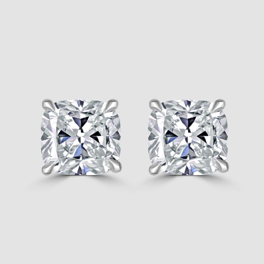 Stunning platinum cushion cut diamond stud earrings