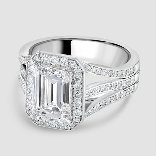 Superb emerald cut diamond with triple split shoulders