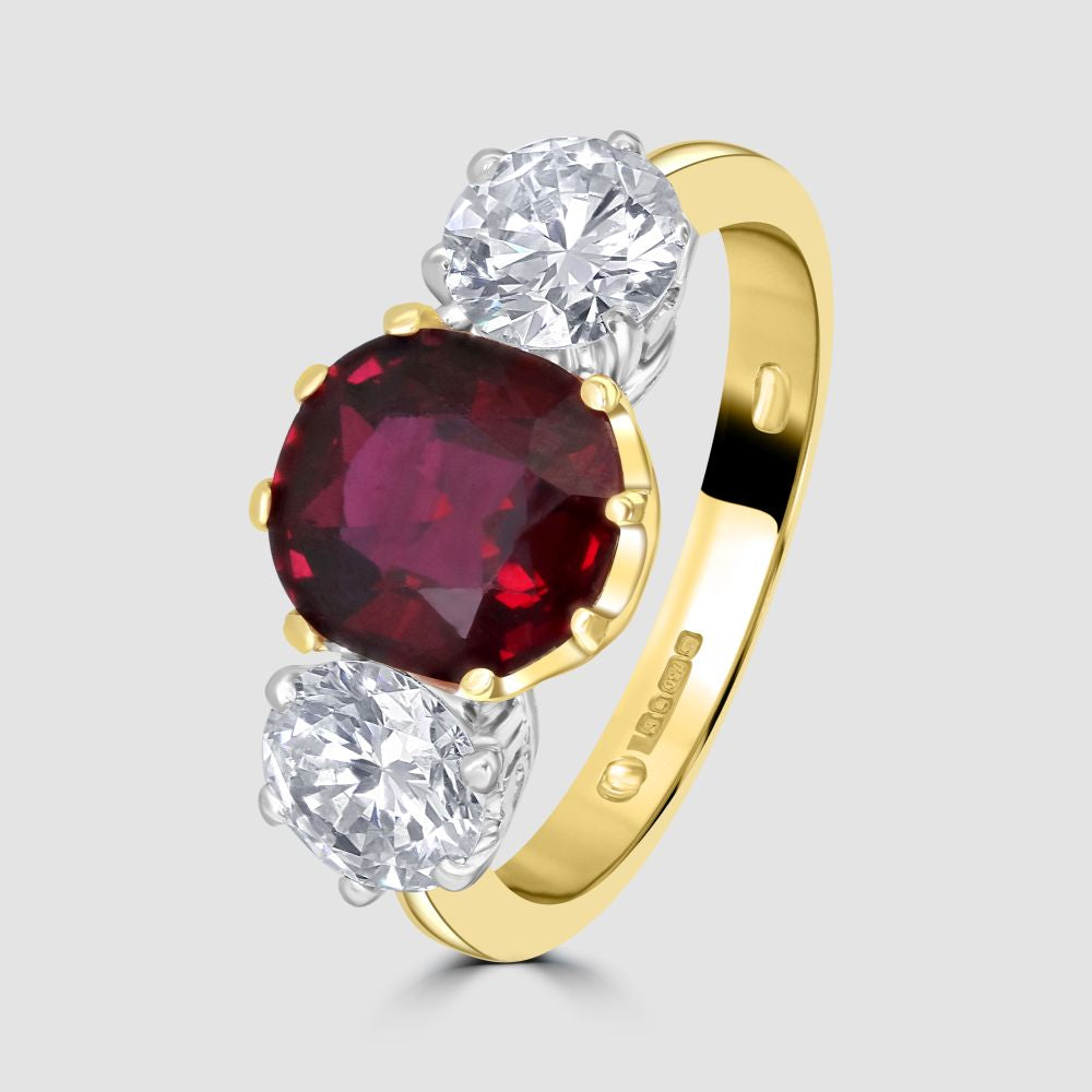 Superior ruby and diamond claw set three stone ring