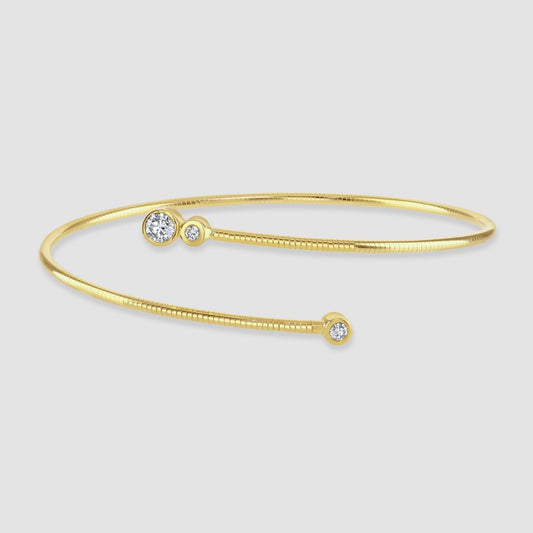 Torque style yellow gold diamond bangle