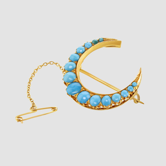 Turquoise set crescent shape brooch