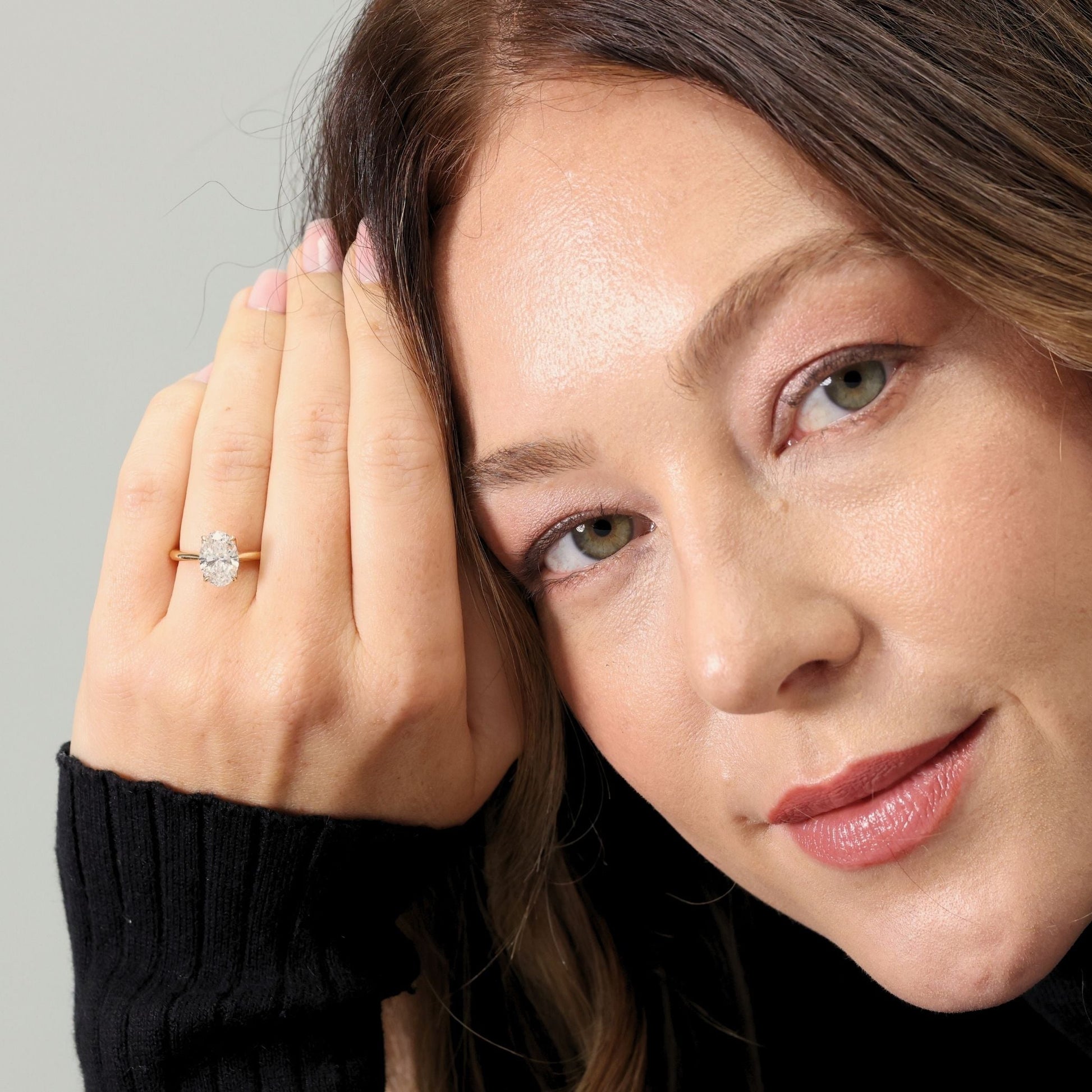 Oval cut laboratory diamond solitaire ring with ‘Bloom’ setting