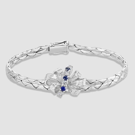 Bow style bracelet set with sapphires and diamonds