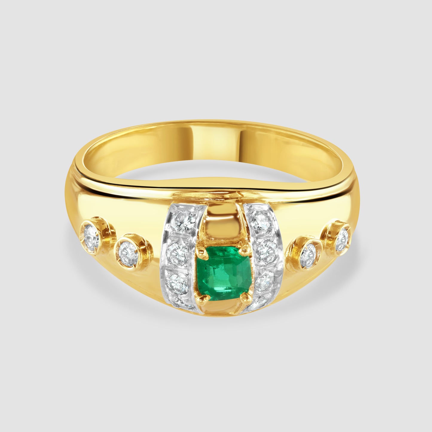 Emerald and diamond bombe design ring