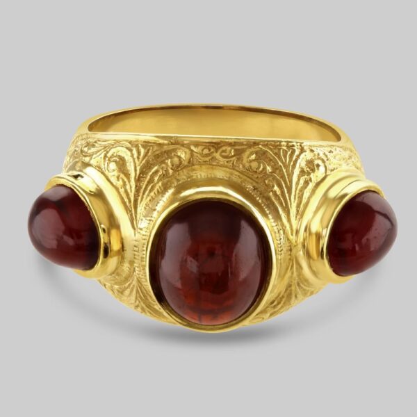 Etruscan style garnet three stone ring